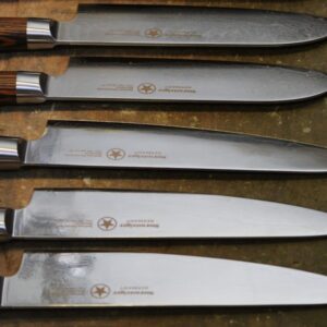 a bunch of knives that are on a table